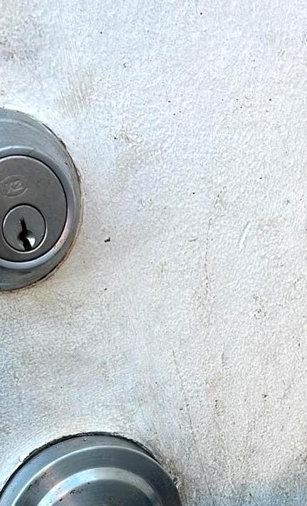 Commercial deadbolt and handle installed on a commercial door on Amelia Island, Fernandina Beach FL 32034