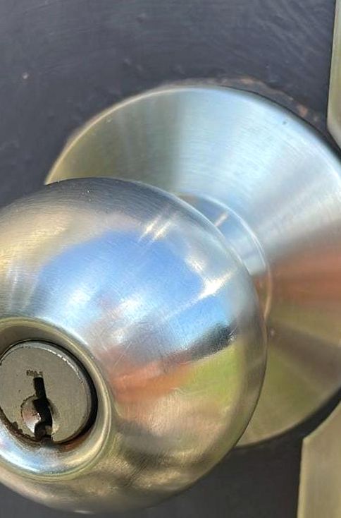 Commercial door knob installed with a guard plate on Amelia Island, Fernandina Beach FL 32034