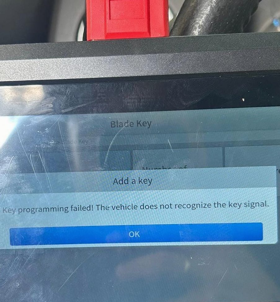 Locksmith programming a new key fob for a customer's car on Amelia Island, Fernandina Beach FL 32034